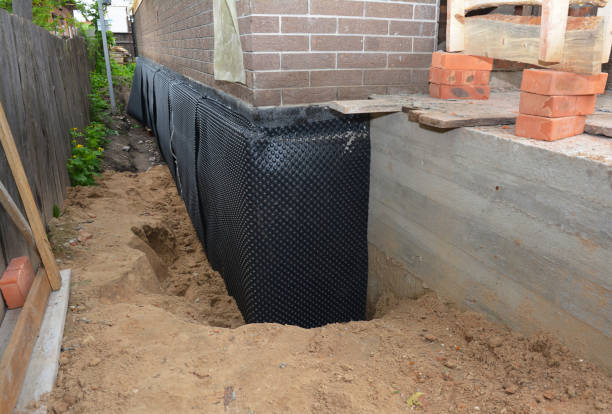 Happy homeowners after waterproofing job in Harbor View